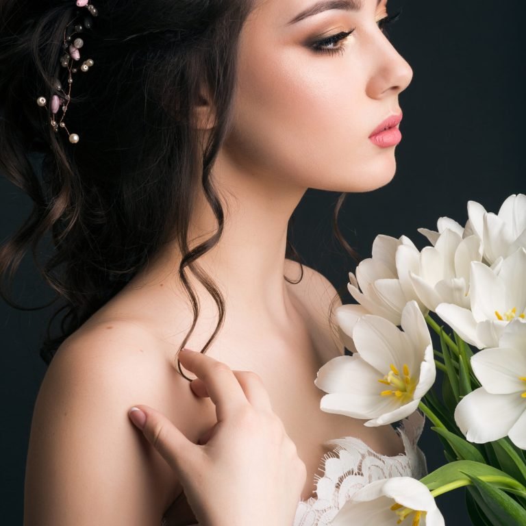 young beautiful stylish woman, bride, bridal fashion, spring trend, flowers, tulips, hairstyle, beauty make-up, white dress, tenderness, innocence, dark background